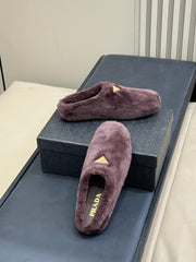 PRADA 25S CLOGS IN WINE RED SHEARLING