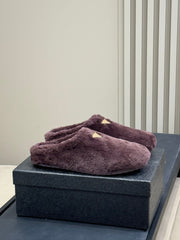PRADA 25S CLOGS IN WINE RED SHEARLING