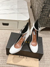 ALAIA ROUND-TOE HIGH HEELS 10 CM IN WHITE CALFSKIN