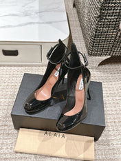 ALAIA ROUND-TOE HIGH HEELS 10 CM IN BLACK CALFSKIN