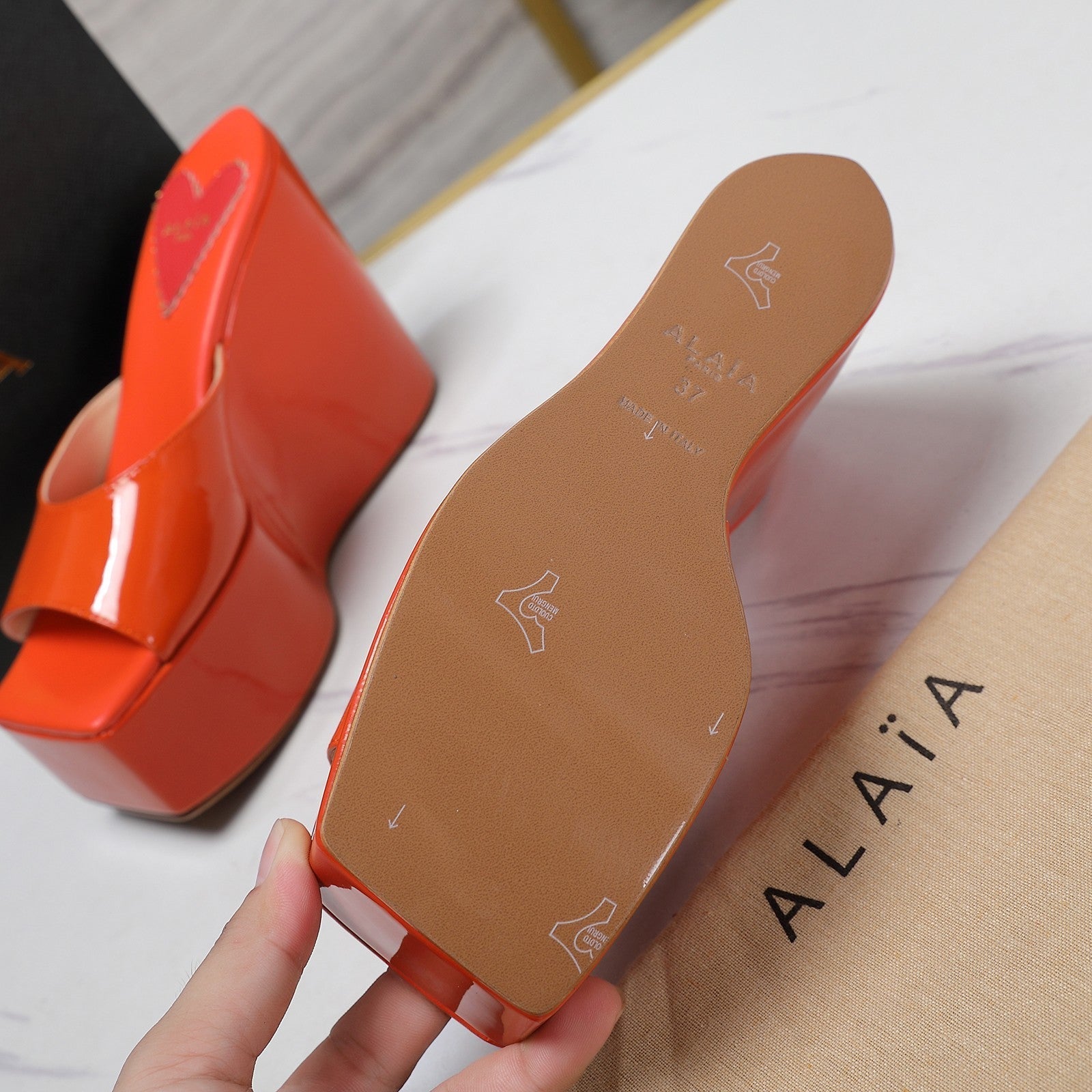 ALAIA PLATFORM WEDGE IN VIVID ORANGE LAMBSKIN WITH RED HEART