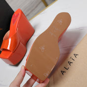ALAIA PLATFORM WEDGE IN VIVID ORANGE LAMBSKIN WITH RED HEART