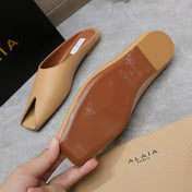 ALAIA FLAT MULE IN SEPIA TAN LAMBSKIN