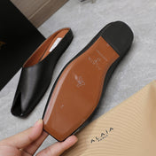 ALAIA FLAT MULE IN BLACK LAMBSKIN