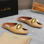 ALAIA FLAT MULE IN SEPIA TAN LAMBSKIN WITH GOLD HARDWARE