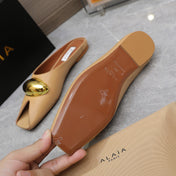 ALAIA FLAT MULE IN SEPIA TAN LAMBSKIN WITH GOLD HARDWARE