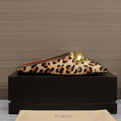 ALAIA FLAT MULE IN LEOPARD LAMBSKIN WITH GOLD HARDWARE