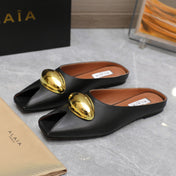 ALAIA FLAT MULE IN BLACK LAMBSKIN WITH GOLD HARDWARE