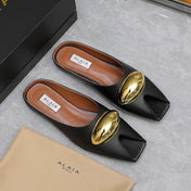 ALAIA FLAT MULE IN BLACK LAMBSKIN WITH GOLD HARDWARE