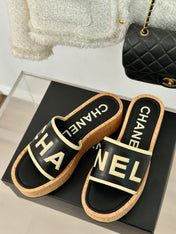 THICK SOLE LETTER SLIPPERS IN BLACK SHEEPSKIN