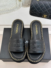 THICK SOLE WEDGE SLIPPERS IN BLACK CALFSKIN