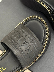 THICK SOLE WEDGE SLIPPERS IN BLACK CALFSKIN