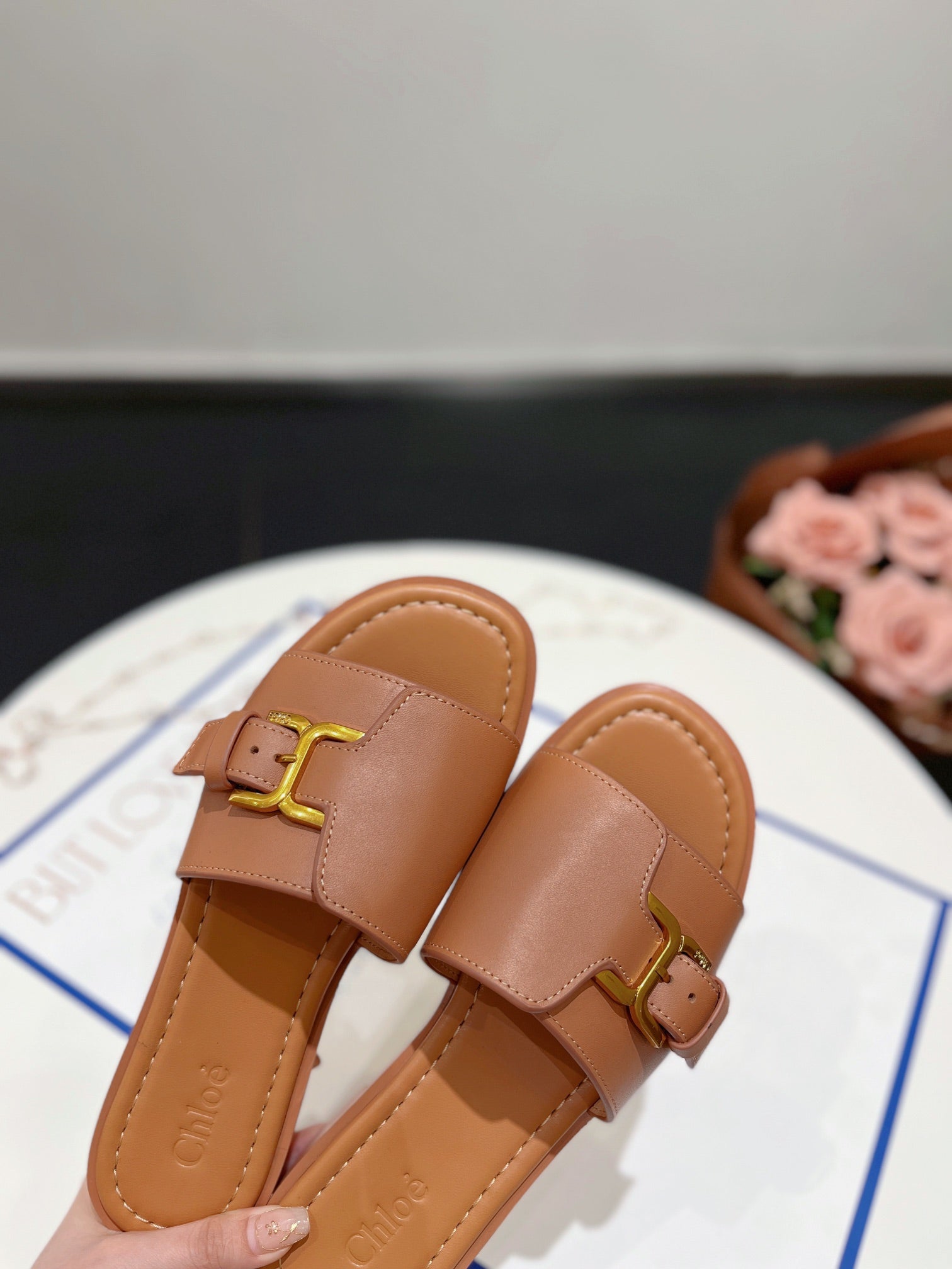 MARCIE SLIDE IN BRONZE BROWN CALFSKIN WITH GOLD HARDWARE