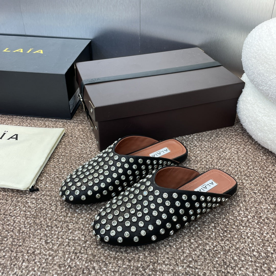 ALAIA FLAT MULES 25S IN BLACK LAMBSKIN EMBELLISHED WITH CRYSTALS