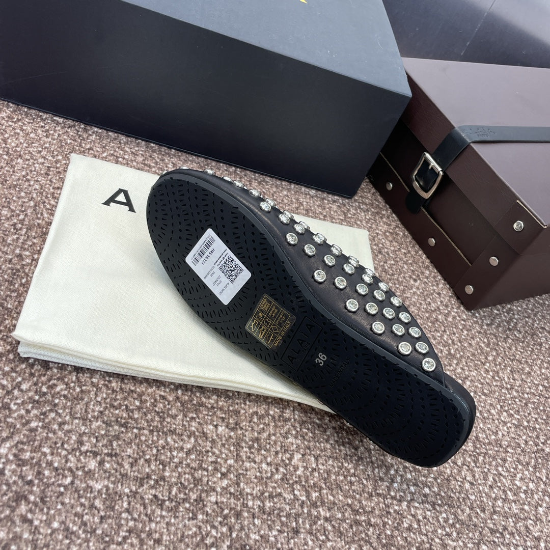 ALAIA FLAT MULES 25S IN BLACK LAMBSKIN EMBELLISHED WITH CRYSTALS