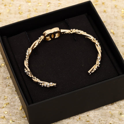 CC TWIST OPEN CUFF GOLD BRACELET